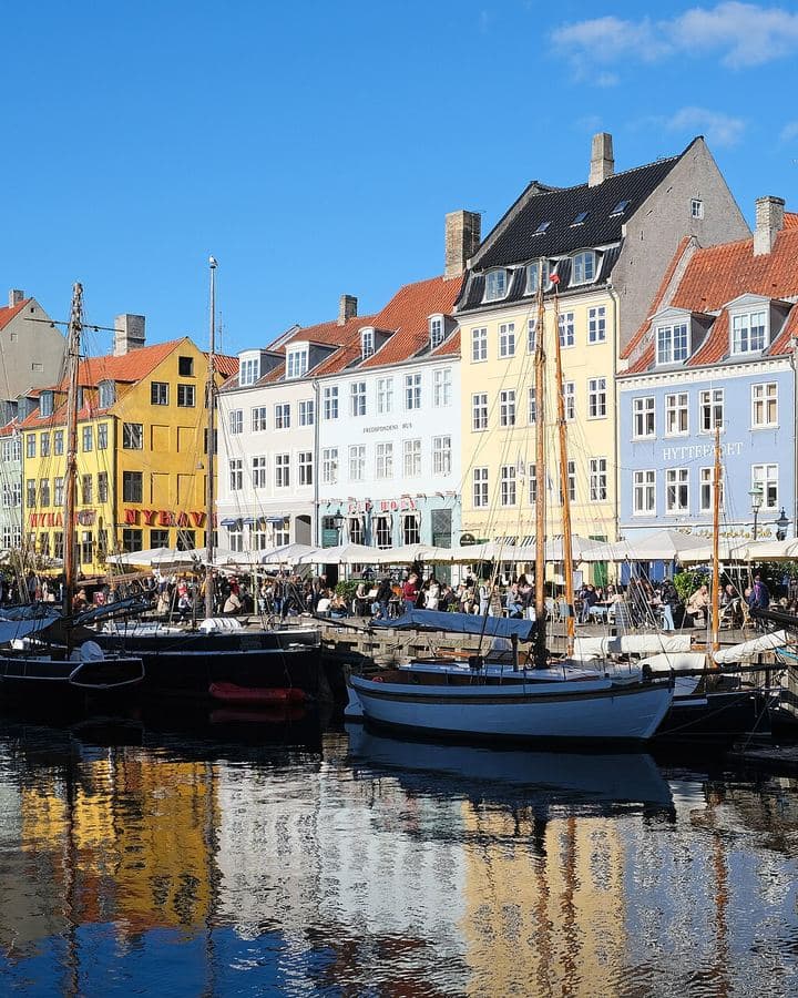 Colourful houses and boats along Nyhavn in Copenhagen