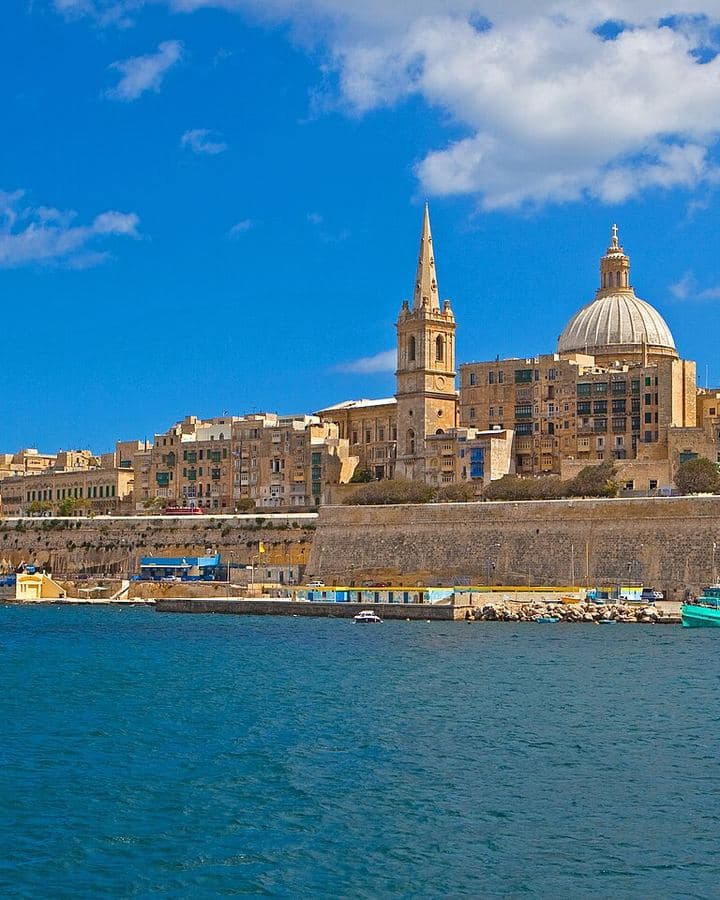 Valletta's honey-coloured skyline and dome across the harbour