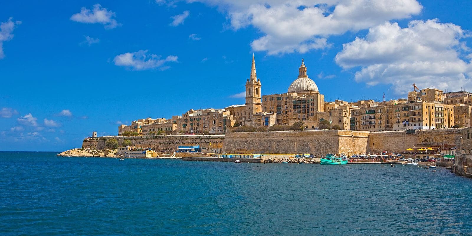 Valletta's honey-coloured skyline and dome across the harbour